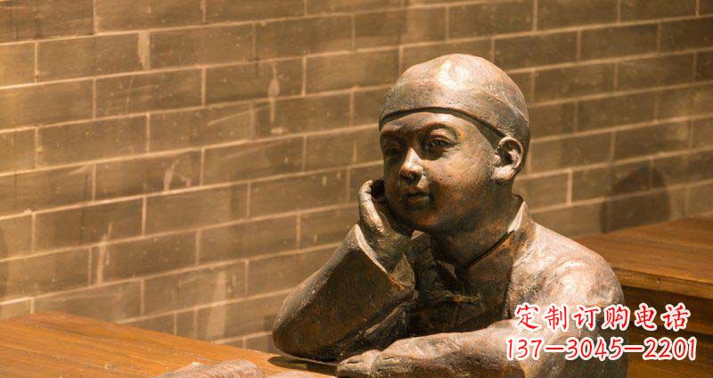 威海商场坐在桌前看书的小孩景观铜雕